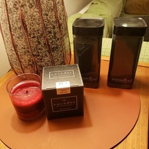 Scented candle and black decor sand